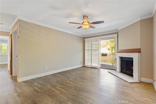1710 S El Camino Real Unit E204, Encinitas, CA 92024 - unfurnished living room featuring a ceiling fan, a fireplace, ornamental molding, and wood finished floors