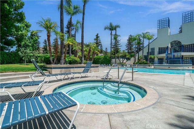 5722 E Stillwater Ave Unit 104, Orange, CA 92869 - community pool featuring a hot tub and a patio area