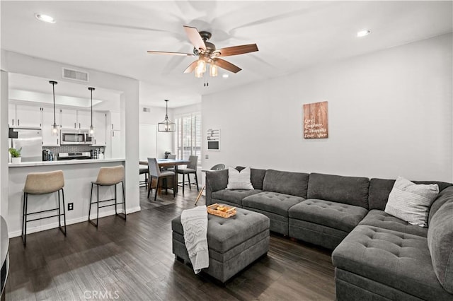 5722 E Stillwater Ave Unit 104, Orange, CA 92869 - living area featuring a ceiling fan, dark wood-style floors, and recessed lighting