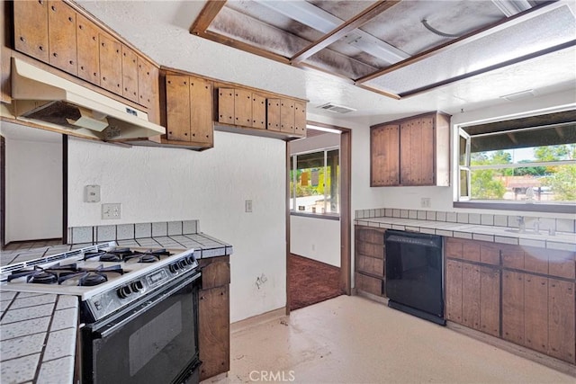 19215 Hupa Rd, Apple Valley, CA 92307 - kitchen with black appliances, tile counters, range hood, and healthy amount of natural light