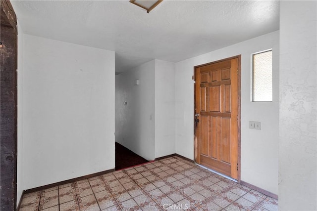 19215 Hupa Rd, Apple Valley, CA 92307 - foyer entrance featuring a textured ceiling and light floors