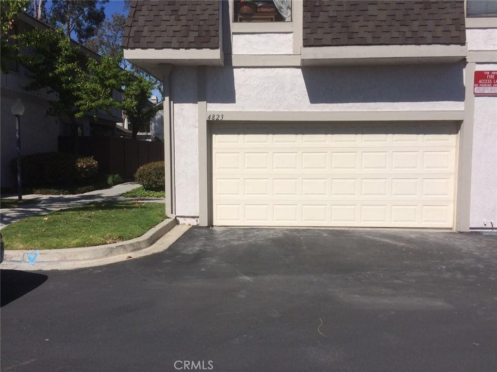 4823 Fieldbrook Ln Unit 24, Cypress, CA 90630 - garage featuring driveway