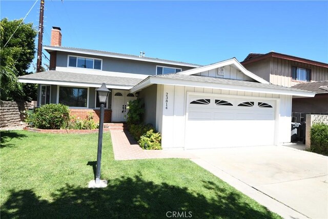 23814 Walnut St, Torrance, CA 90501 - view of front of home with a garage, a chimney, concrete driveway, a front yard, and brick siding