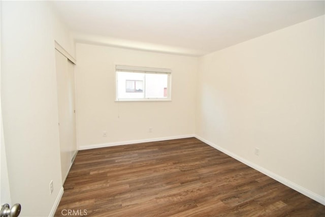 23814 Walnut St, Torrance, CA 90501 - unfurnished bedroom featuring dark wood-style flooring and a closet