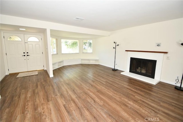 23814 Walnut St, Torrance, CA 90501 - foyer entrance featuring wood finished floors and a brick fireplace