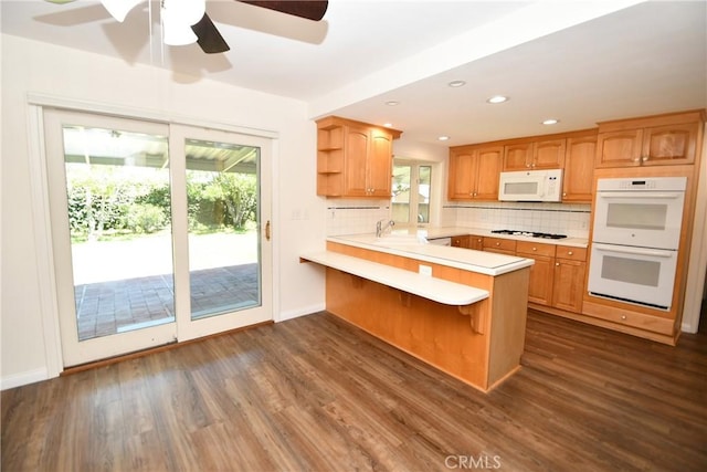 23814 Walnut St, Torrance, CA 90501 - kitchen with white appliances, light countertops, open shelves, dark wood-type flooring, and backsplash