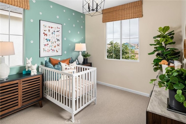 25165 Hunter Ave, Moreno Valley, CA 92551 - bedroom with carpet floors, a chandelier, and a nursery area