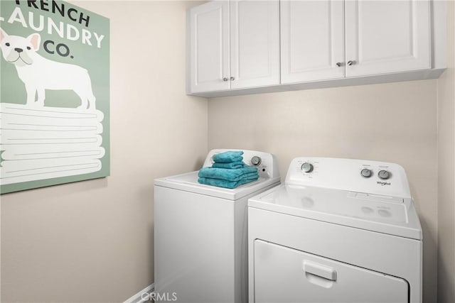 25165 Hunter Ave, Moreno Valley, CA 92551 - laundry room featuring washing machine and clothes dryer and cabinet space