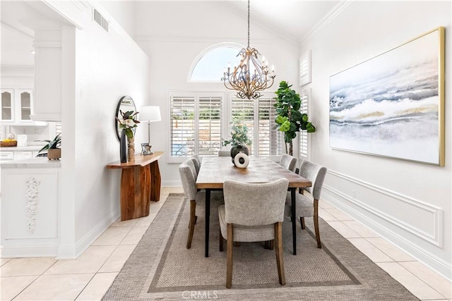 29813 Via Sevilla, Temecula, CA 92591 - dining space with light tile patterned floors, a chandelier, ornamental molding, and high vaulted ceiling