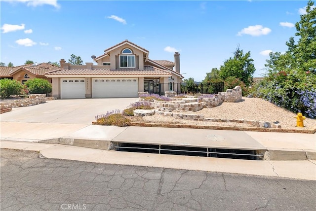 29813 Via Sevilla, Temecula, CA 92591 - view of front facade with a tiled roof, stucco siding, concrete driveway, and an attached garage