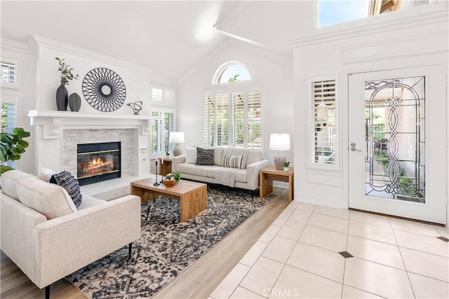 29813 Via Sevilla, Temecula, CA 92591 - living room with wood finished floors, a glass covered fireplace, crown molding, and high vaulted ceiling