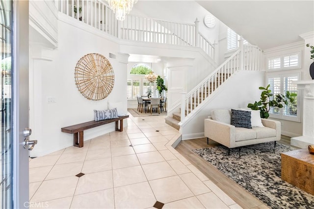 29813 Via Sevilla, Temecula, CA 92591 - entrance foyer featuring a high ceiling, plenty of natural light, a chandelier, and light tile patterned floors