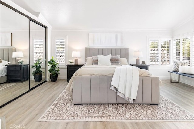 29813 Via Sevilla, Temecula, CA 92591 - bedroom featuring crown molding, multiple windows, and wood finished floors