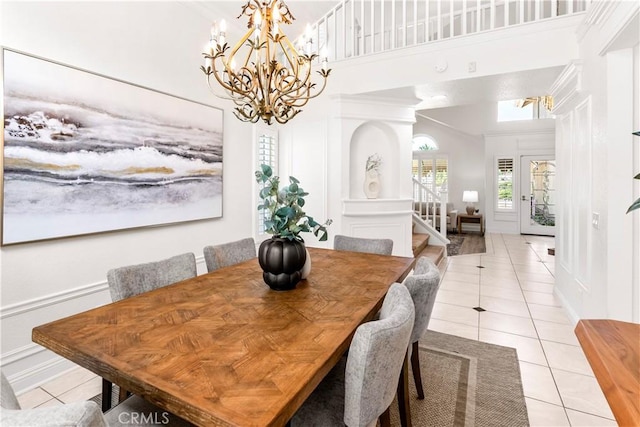 29813 Via Sevilla, Temecula, CA 92591 - dining area featuring light tile patterned floors, a chandelier, a towering ceiling, and crown molding