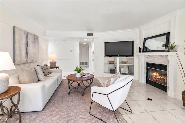 29813 Via Sevilla, Temecula, CA 92591 - living area featuring a glass covered fireplace, ornamental molding, and light tile patterned floors