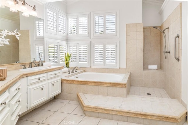 29813 Via Sevilla, Temecula, CA 92591 - full bathroom featuring a garden tub, vanity, ornamental molding, tile patterned flooring, and a tile shower