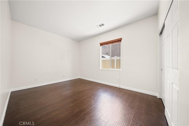 28677 Sunridge Ct, Menifee, CA 92584 - unfurnished bedroom with dark wood-type flooring and a closet