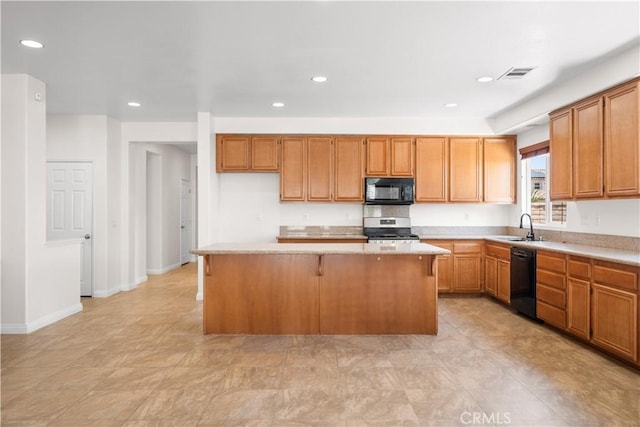 28677 Sunridge Ct, Menifee, CA 92584 - kitchen with black appliances, a kitchen island, light countertops, recessed lighting, and a breakfast bar