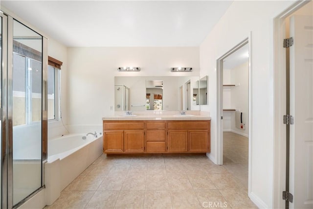 28677 Sunridge Ct, Menifee, CA 92584 - full bath featuring a stall shower, double vanity, plenty of natural light, and a bath