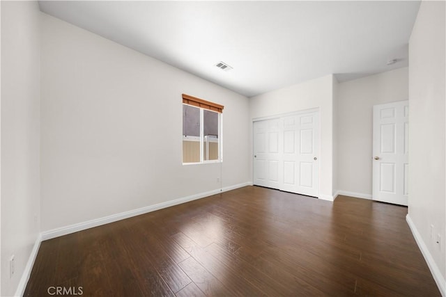 28677 Sunridge Ct, Menifee, CA 92584 - unfurnished bedroom with wood finished floors and a closet