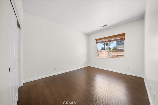 28677 Sunridge Ct, Menifee, CA 92584 - unfurnished bedroom featuring dark wood-type flooring and a closet