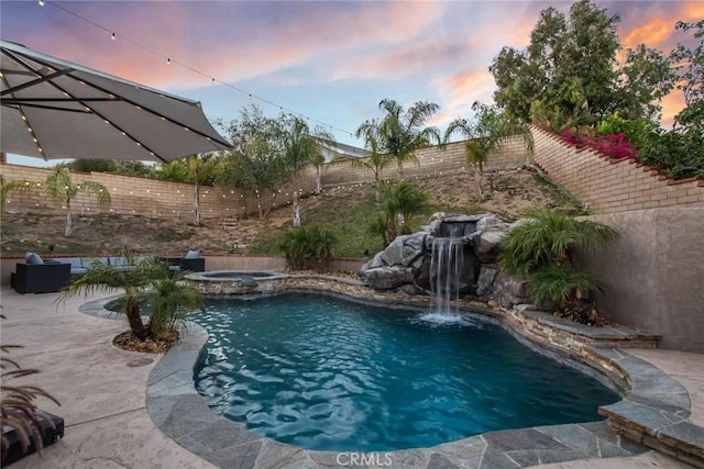 23235 Redbud Ridge Cir, Valencia, CA 91354 - pool at dusk featuring a fenced backyard, a patio area, and a pool with connected hot tub