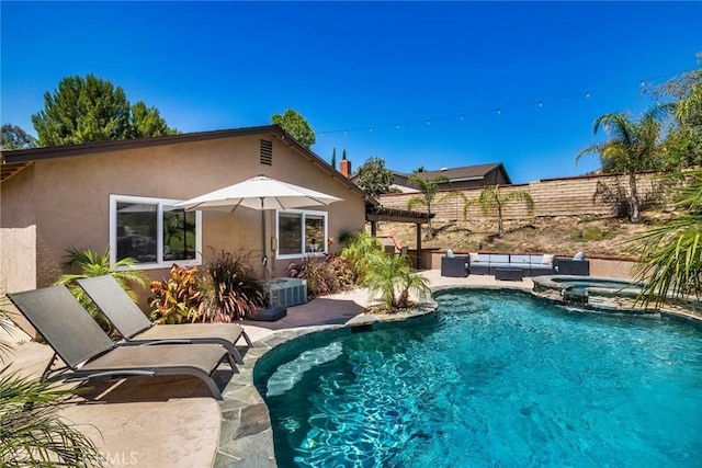23235 Redbud Ridge Cir, Valencia, CA 91354 - view of pool featuring a patio, an outdoor hangout area, a pool with connected hot tub, and a pergola