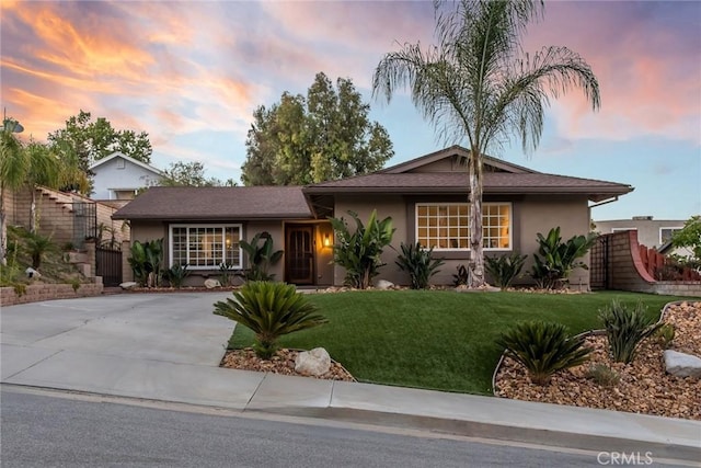 23235 Redbud Ridge Cir, Valencia, CA 91354 - single story home featuring stucco siding, a front lawn, and concrete driveway
