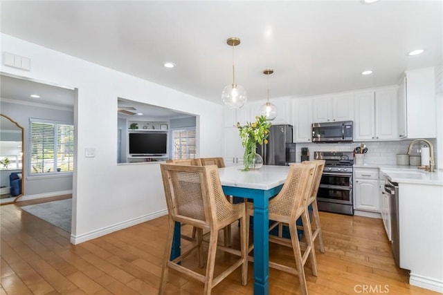 23235 Redbud Ridge Cir, Valencia, CA 91354 - dining space featuring light wood-style flooring and recessed lighting