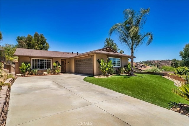 23235 Redbud Ridge Cir, Valencia, CA 91354 - single story home with a garage, a front yard, stucco siding, and driveway