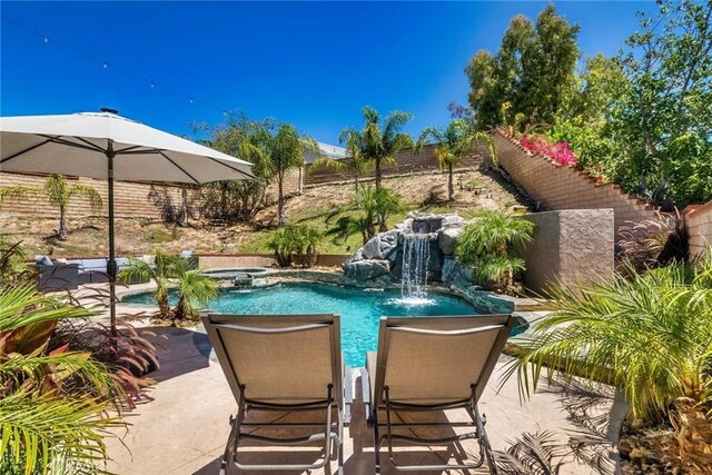 23235 Redbud Ridge Cir, Valencia, CA 91354 - view of pool featuring a fenced backyard, a patio area, and a pool with connected hot tub