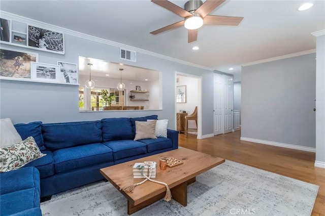 23235 Redbud Ridge Cir, Valencia, CA 91354 - living room featuring wood finished floors, a ceiling fan, crown molding, and recessed lighting