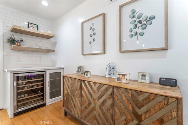 23235 Redbud Ridge Cir, Valencia, CA 91354 - indoor dry bar with wine cooler, light wood-style floors, and recessed lighting