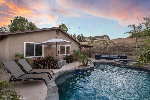 23235 Redbud Ridge Cir, Valencia, CA 91354 - pool at dusk featuring a pergola, an outdoor living space, a patio, and a pool with connected hot tub