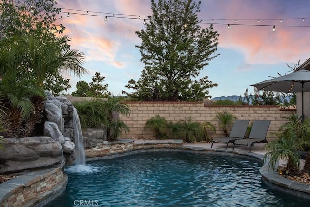 23235 Redbud Ridge Cir, Valencia, CA 91354 - pool at dusk with a mountain view