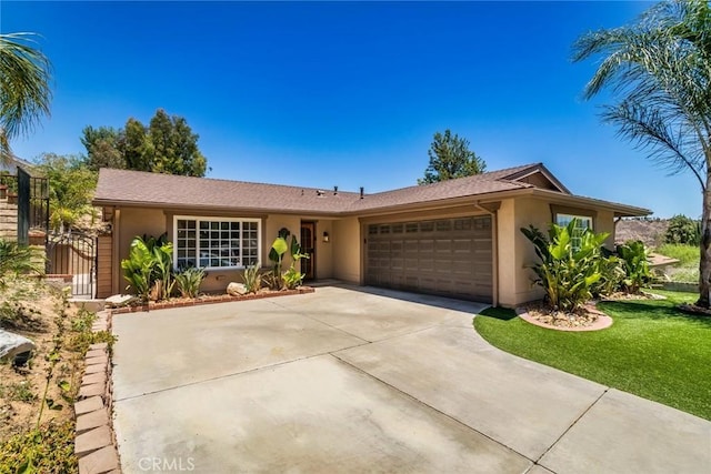 23235 Redbud Ridge Cir, Valencia, CA 91354 - ranch-style house featuring stucco siding, a garage, concrete driveway, and a front yard