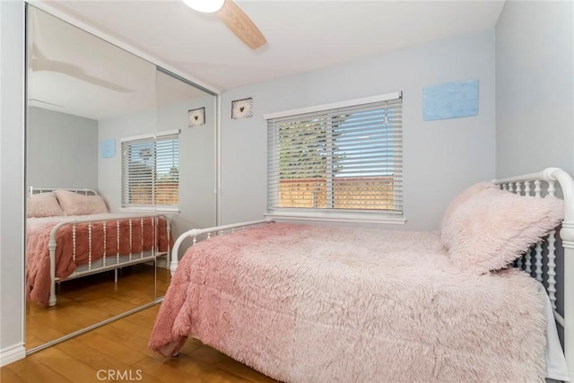 23235 Redbud Ridge Cir, Valencia, CA 91354 - bedroom with wood finished floors and ceiling fan