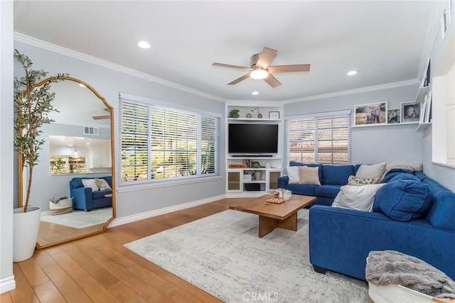 23235 Redbud Ridge Cir, Valencia, CA 91354 - living area featuring a ceiling fan, wood finished floors, healthy amount of natural light, crown molding, and recessed lighting