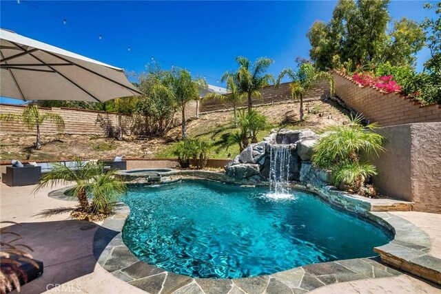 23235 Redbud Ridge Cir, Valencia, CA 91354 - view of swimming pool featuring a fenced backyard, a patio area, and a pool with connected hot tub