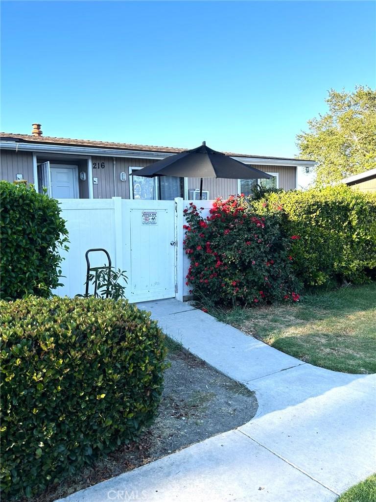 25821 Via Lomas Unit 216, Laguna Hills, CA 92653 - view of home's exterior featuring a gate