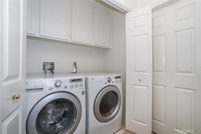 27960 Agapanthus Ln, Valencia, CA 91354 - laundry area with washing machine and dryer and cabinet space