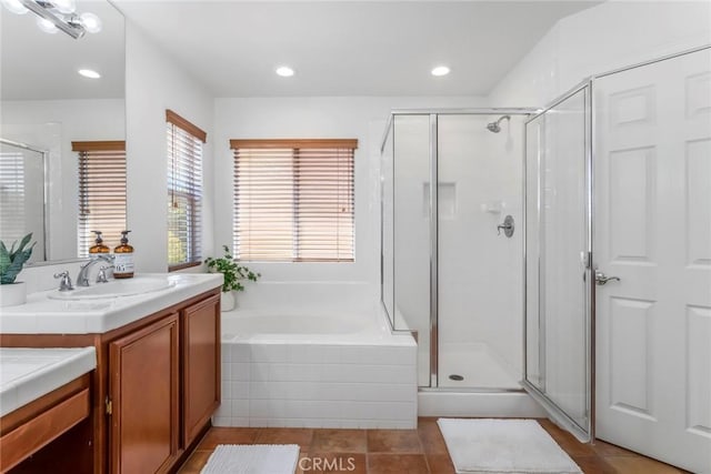 27960 Agapanthus Ln, Valencia, CA 91354 - full bath featuring vanity, a stall shower, a garden tub, recessed lighting, and tile patterned floors