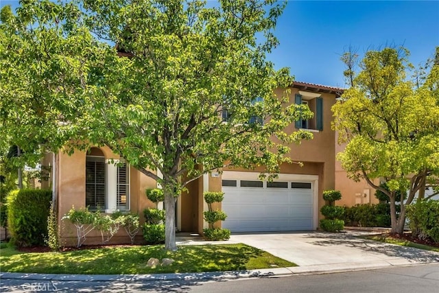27960 Agapanthus Ln, Valencia, CA 91354 - view of front facade featuring concrete driveway, stucco siding, and an attached garage