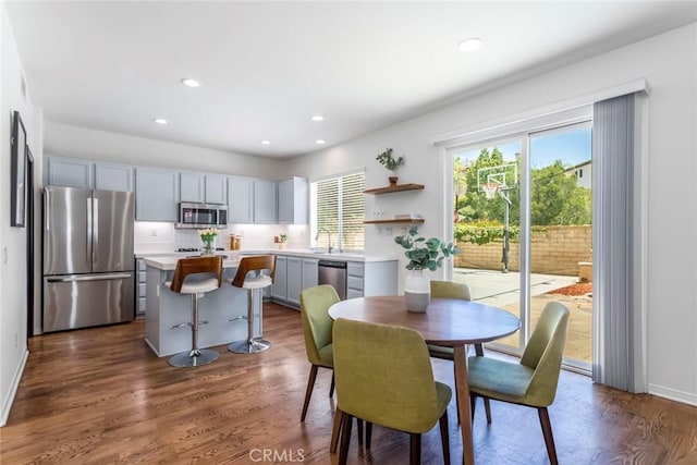 27960 Agapanthus Ln, Valencia, CA 91354 - dining area with dark wood-style flooring and recessed lighting