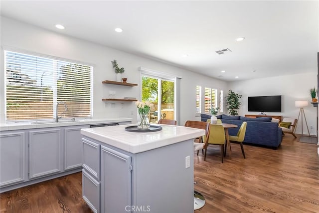 27960 Agapanthus Ln, Valencia, CA 91354 - kitchen with tile countertops, dark wood-style flooring, recessed lighting, open shelves, and open floor plan