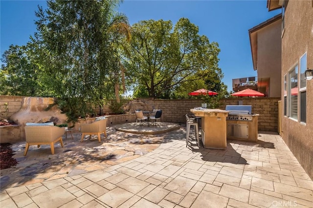 27960 Agapanthus Ln, Valencia, CA 91354 - fenced backyard with area for grilling, a patio, and outdoor dining space