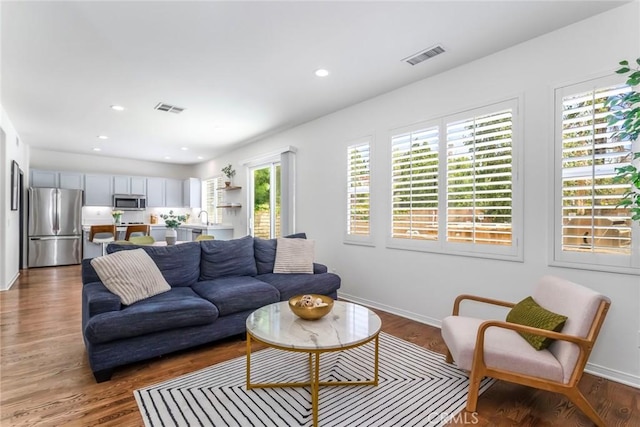 27960 Agapanthus Ln, Valencia, CA 91354 - living room with wood finished floors and recessed lighting