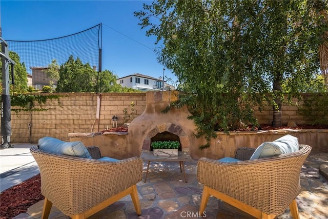 27960 Agapanthus Ln, Valencia, CA 91354 - view of patio with an outdoor stone fireplace