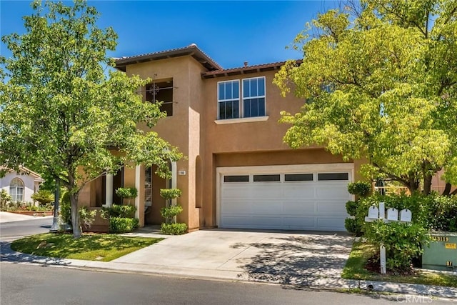 27960 Agapanthus Ln, Valencia, CA 91354 - view of front of home featuring stucco siding, driveway, a garage, and a tile roof