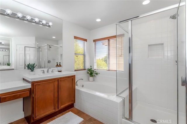 27960 Agapanthus Ln, Valencia, CA 91354 - bathroom with a stall shower, vanity, a bath, and recessed lighting